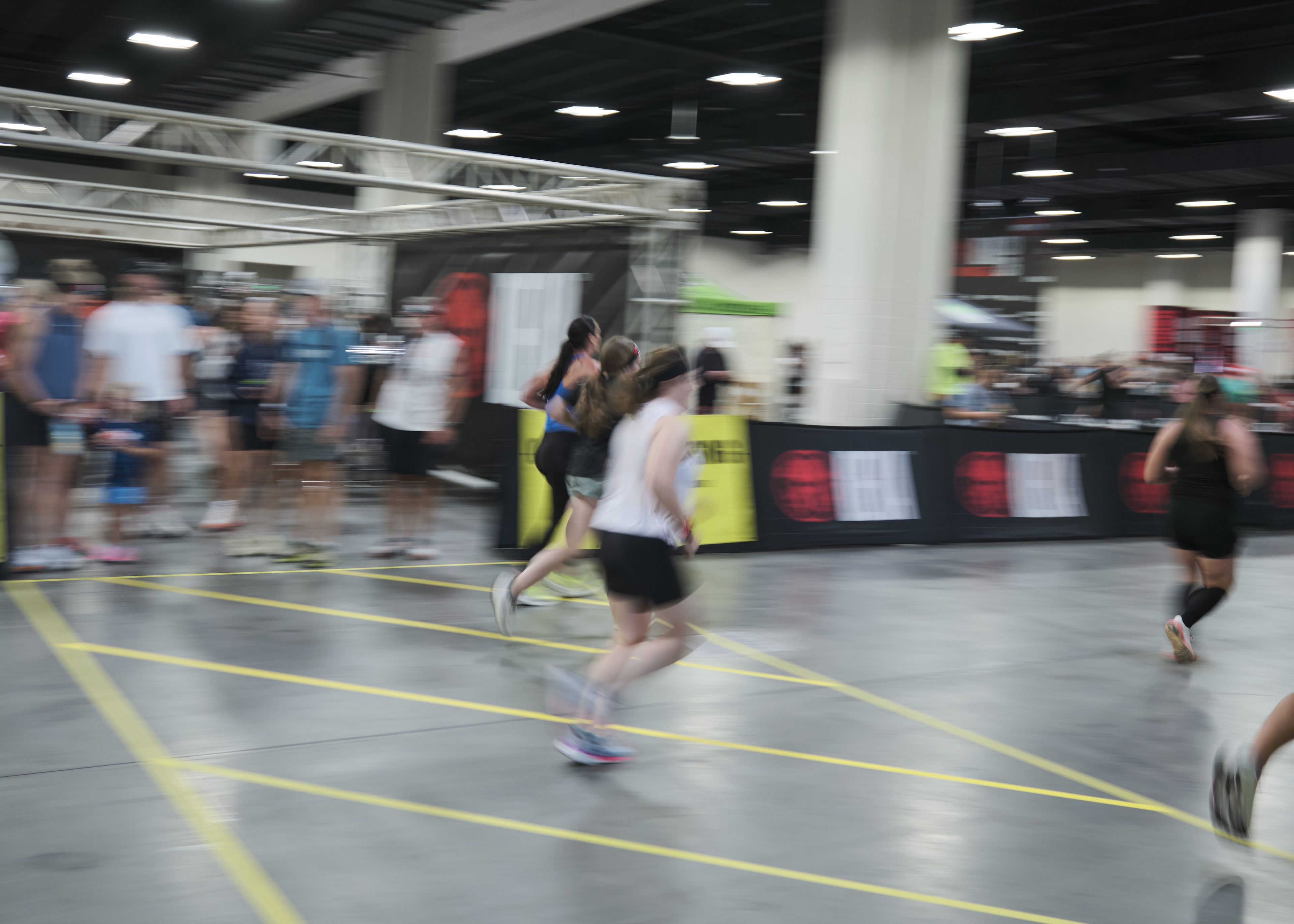 An artistically blurry photograph of runners at a fitness competition
